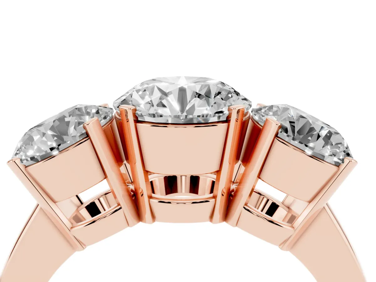Three-Stone Round Cut Cut Diamond Ring with Channel Set Band and Four-Prong Setting Rose gold
