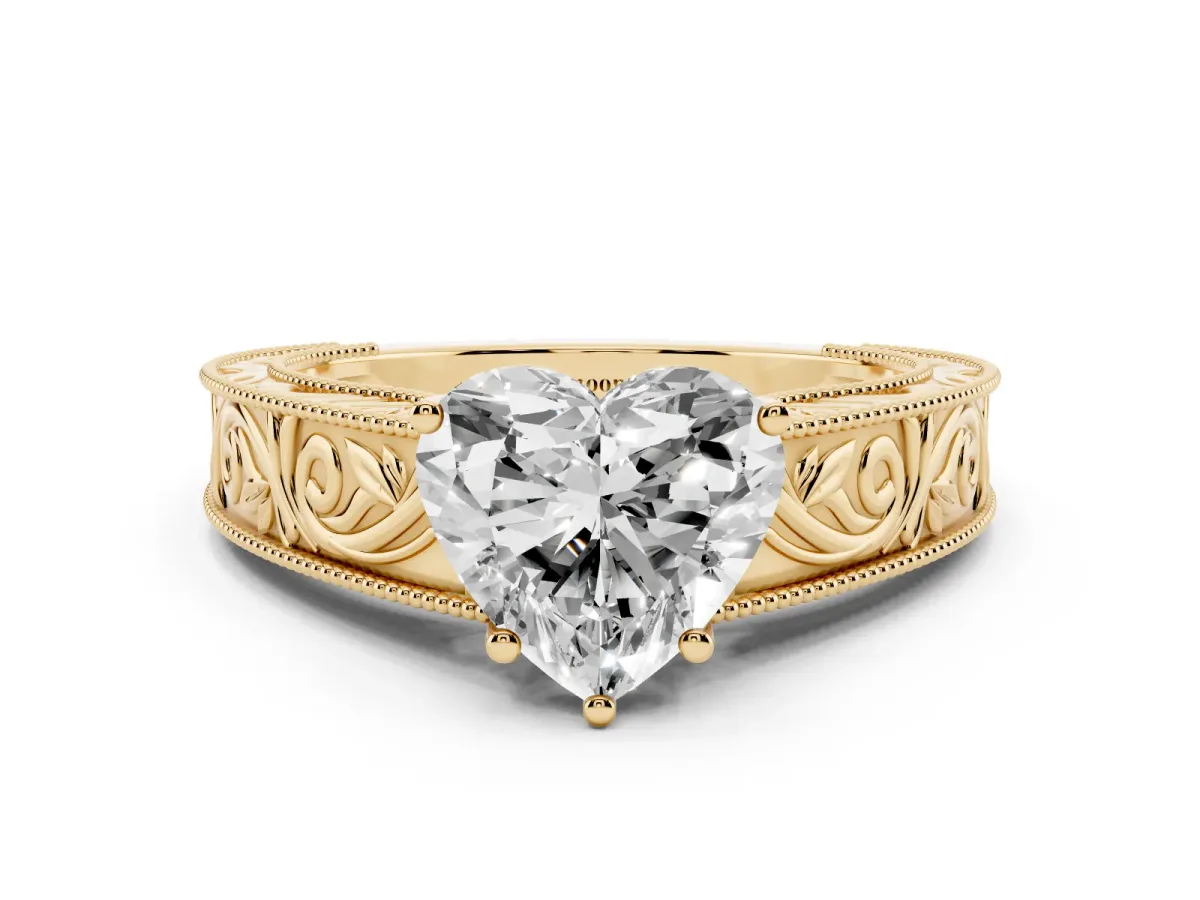 Heart Cut Diamond Solitaire Ring with Engraved Band and Four-Prong Setting Yellow gold
