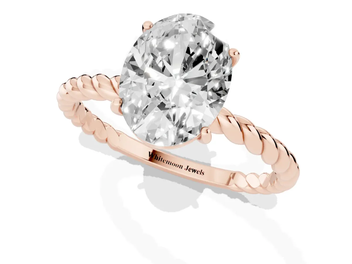 Oval Cut Solitaire Twist Band Ring with Four-Prong Setting Rose gold