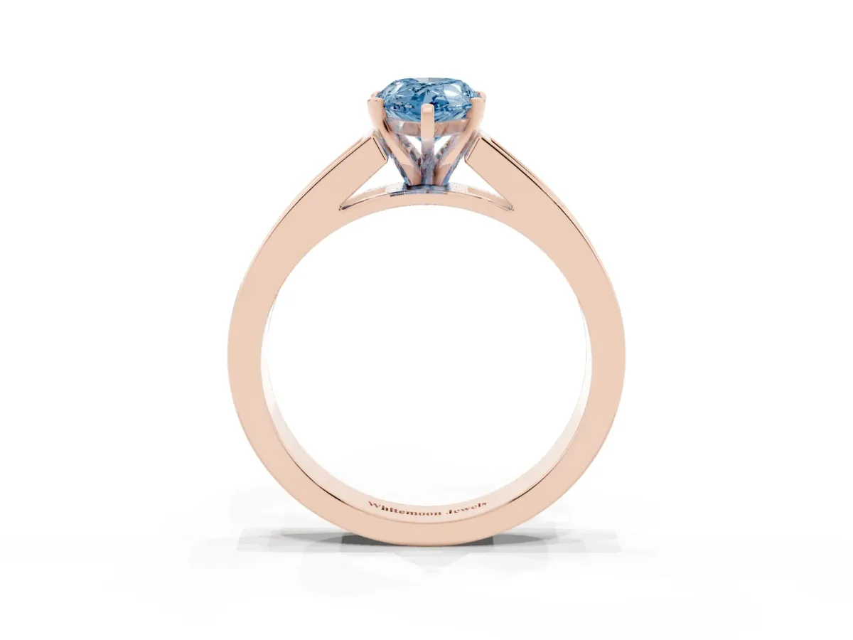 Fancy Blue Pear Cut Solitaire Diamond Ring with Channel-Set Band and Four-Prong Setting Rose gold