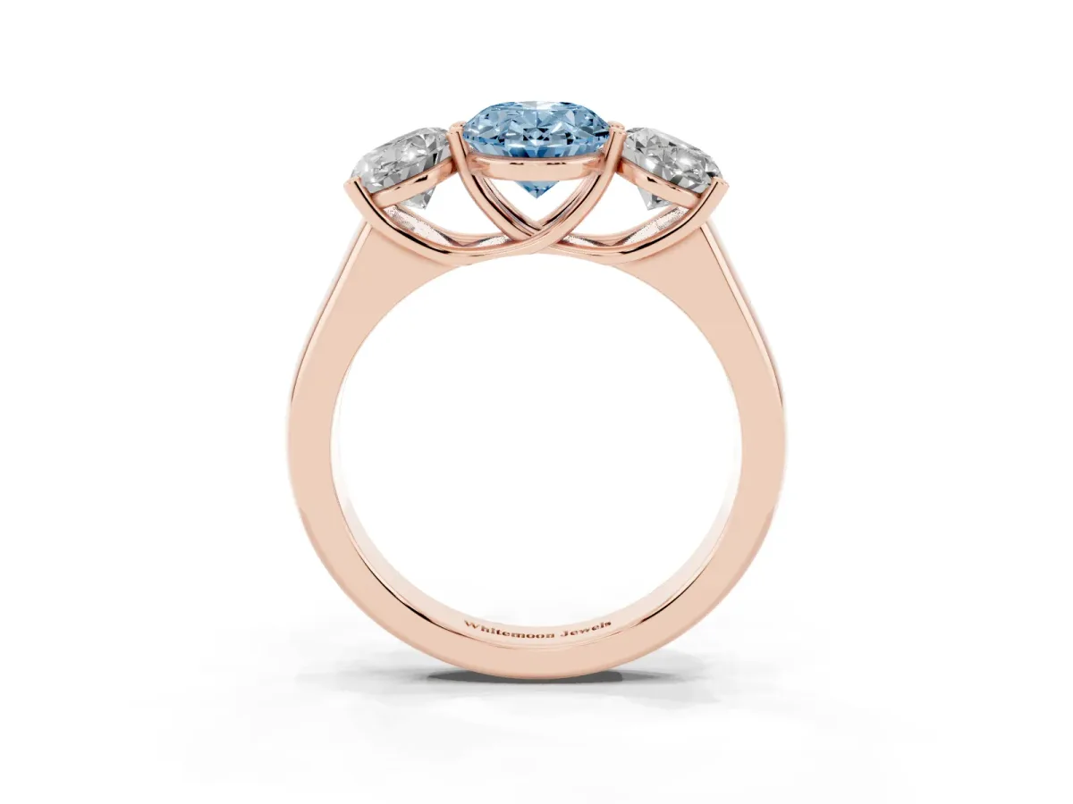 Fancy Blue Oval Cut Three-Stone Diamond Ring with Prong Setting on a Classic Band Rose gold