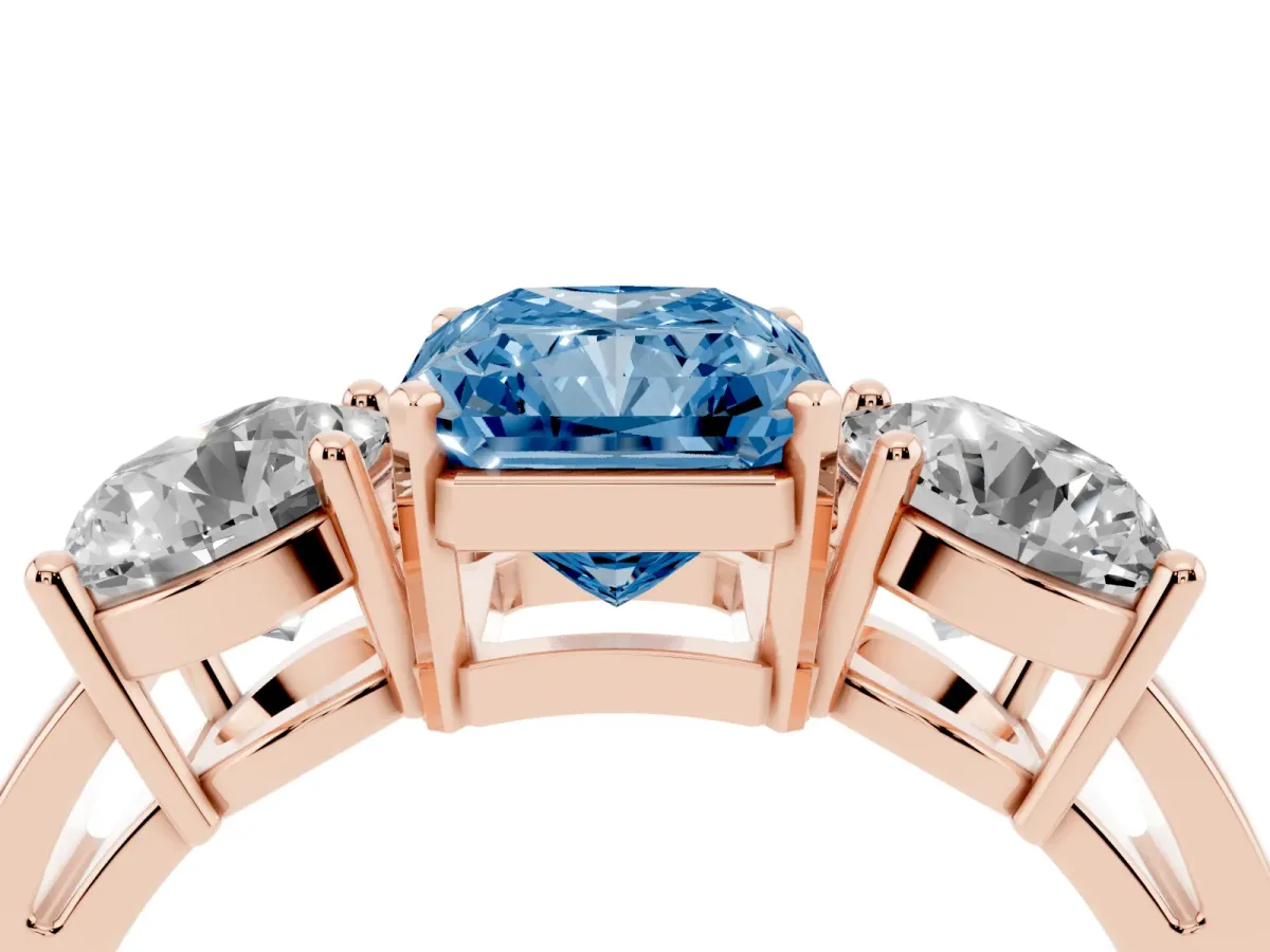 Fancy Blue Three-Stone Radiant Cut Diamond Ring with Round Side Stones, Classic Band, and Four-Prong Setting Rose gold