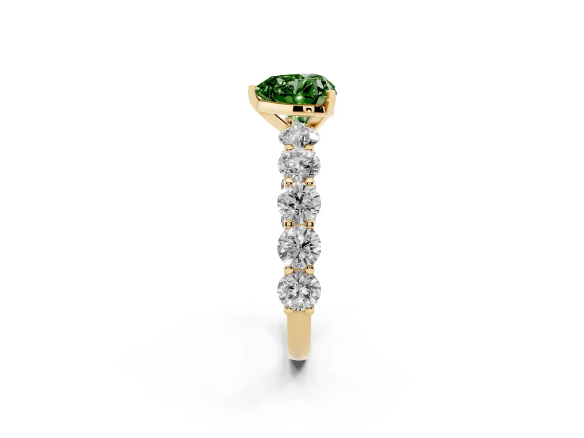 Fancy Green Heart Cut Diamond Prong Setting with Side Stones on a Pave Band Yellow gold