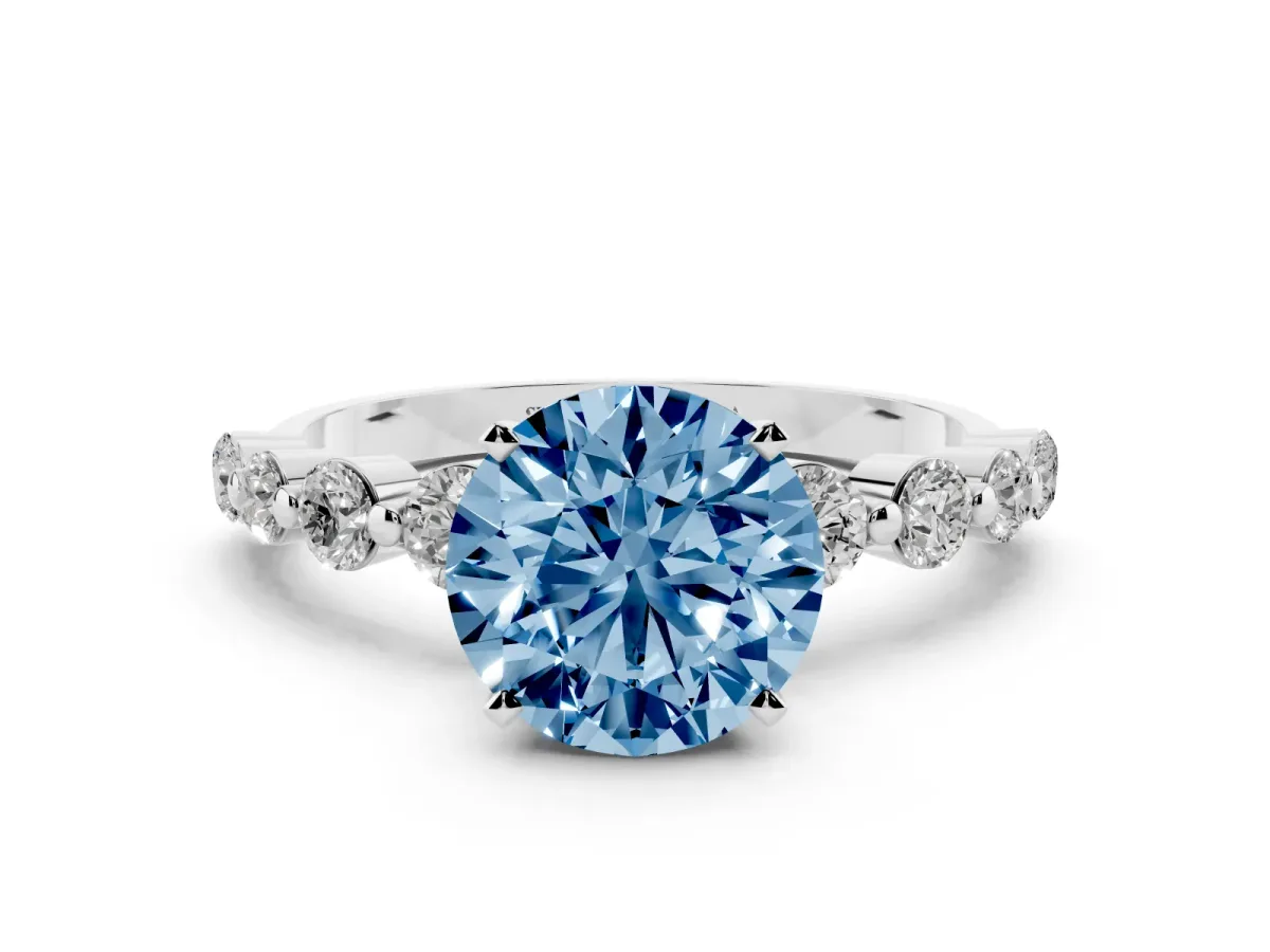 Fancy Blue Round Cut Solitaire Diamond Ring with Pave Band and Four-Prong Setting Silver