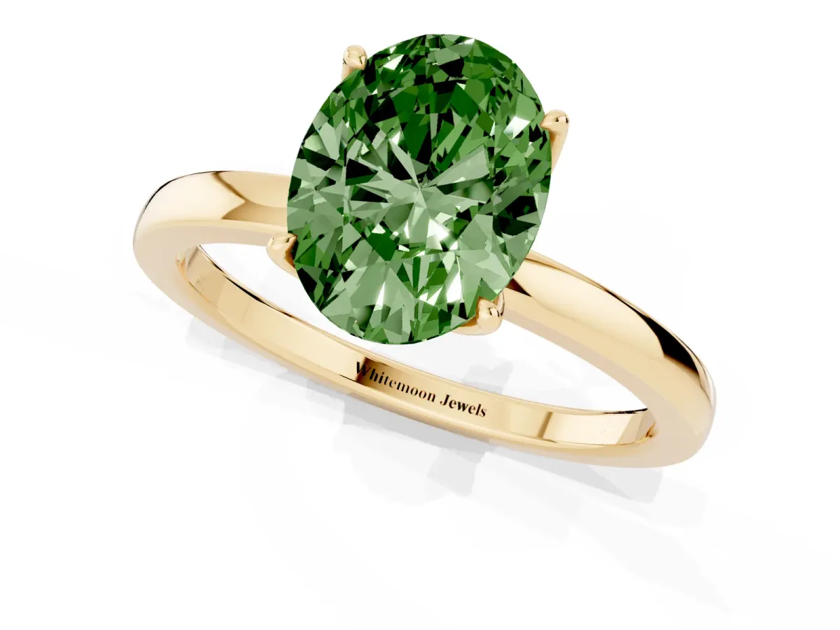 Fancy Green Oval Cut Diamond Solitaire Ring with Thin Band and Prong Setting Yellow gold