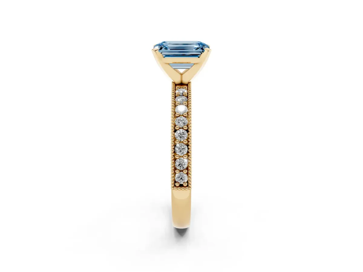 Fancy Blue Emerald Cut Diamond Milgrain Pavé Engagement Ring with Four-Prong Setting Yellow gold