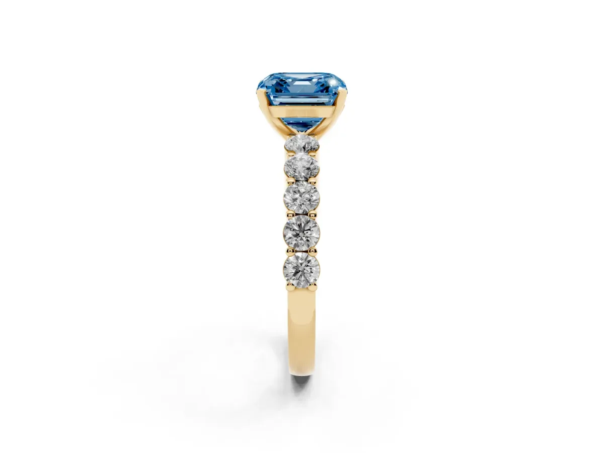 Fancy Blue Asscher Cut Diamond Solitaire Ring with Shared Prong Round Side Stones Yellow gold