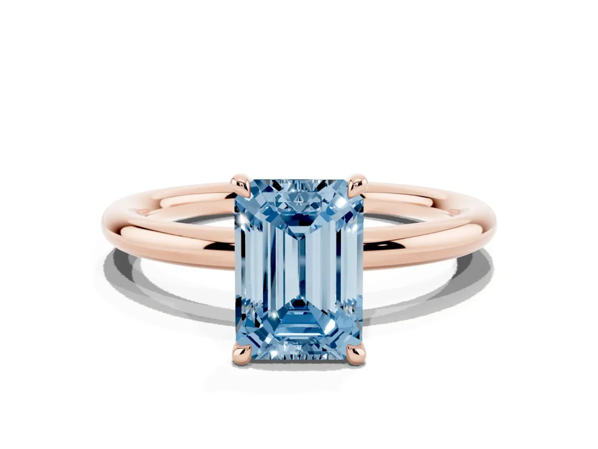 Fancy Blue Emerald Cut Diamond Solitaire Ring with Thin Band and Four-Prong Setting Rose gold