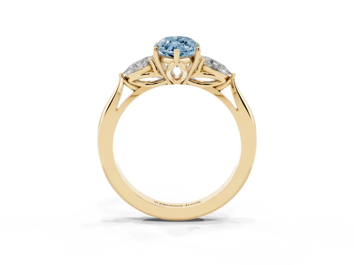 Fancy Blue Marquise Cut Diamond Three-Stone Ring with Pear Side Stones and Prong Setting Yellow gold