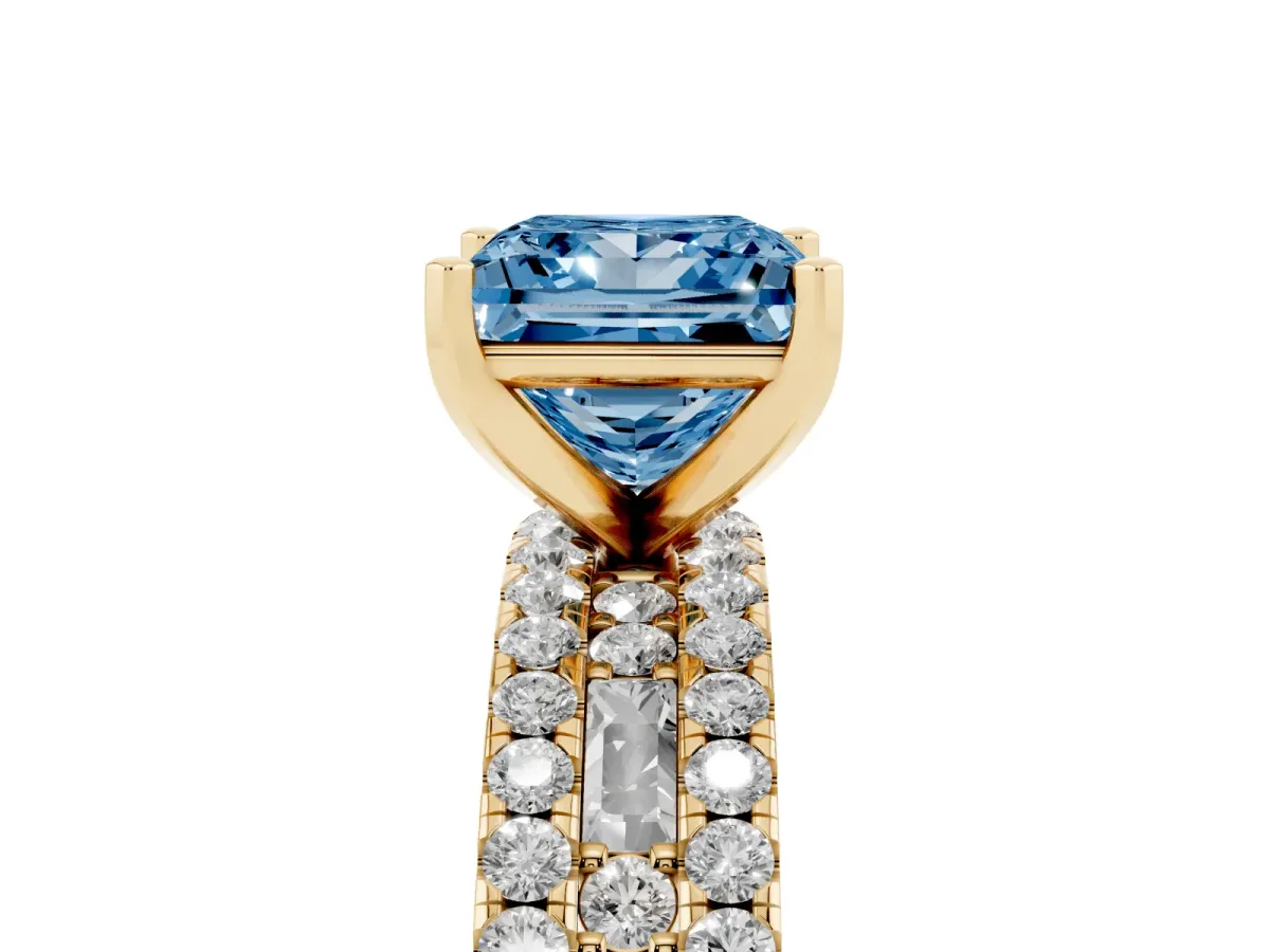 Fancy Blue Princess Cut Diamond Solitaire Ring with Pavé and Channel Set Band Yellow gold