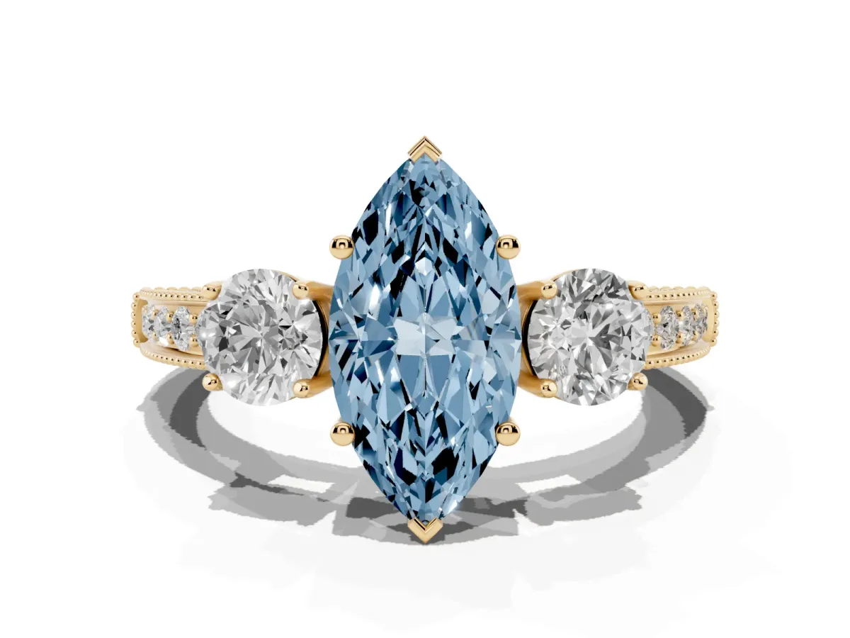Fancy Blue Marquise Cut Three-Stone Diamond Ring with Pavé Band and Four-Prong Setting Yellow gold