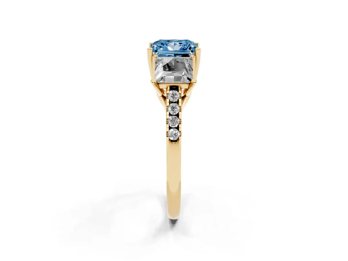 Fancy Blue Three-Stone Princess Cut Diamond Ring with Round Pavé Band and Prong Setting Yellow gold