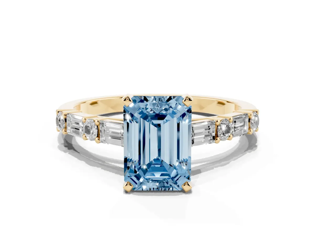 Fancy Blue Emerald Cut Diamond Solitaire with Side Baguettes and Channel Set Band Yellow gold