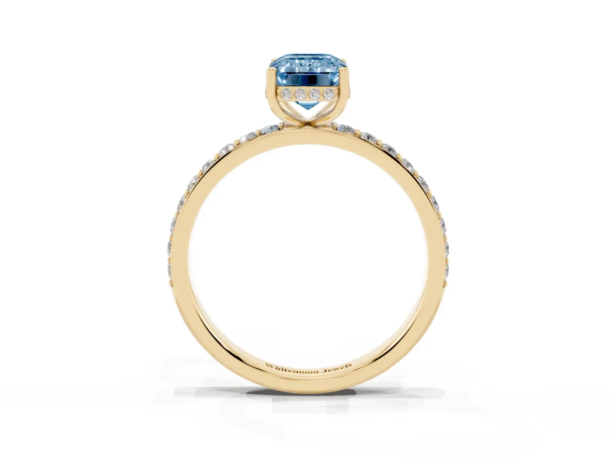 Fancy Blue Emerald Cut Diamond Solitaire Ring with Pavé Band and Hidden Halo Yellow gold