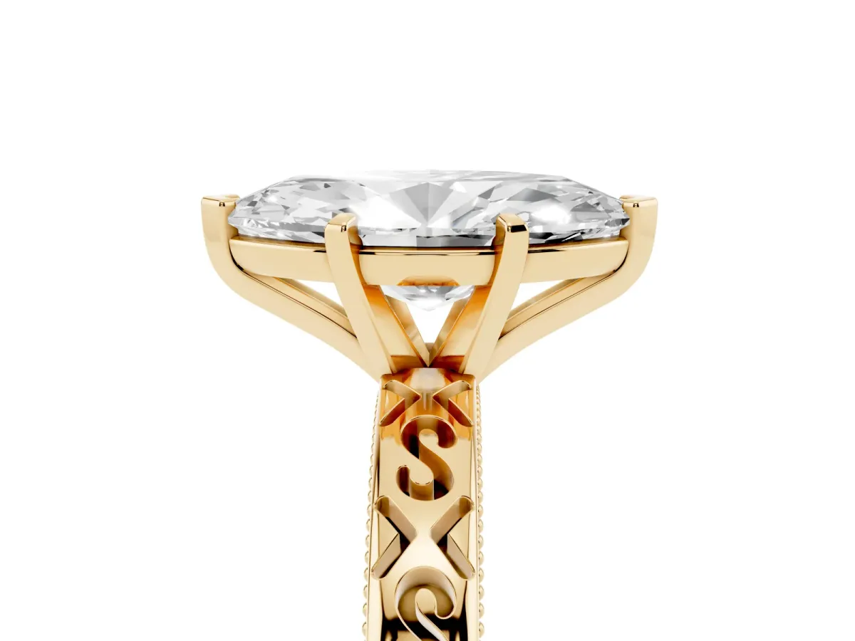 Marquise Cut Solitaire Engagement Ring with Scrollwork Band and Four-Prong Setting Yellow gold