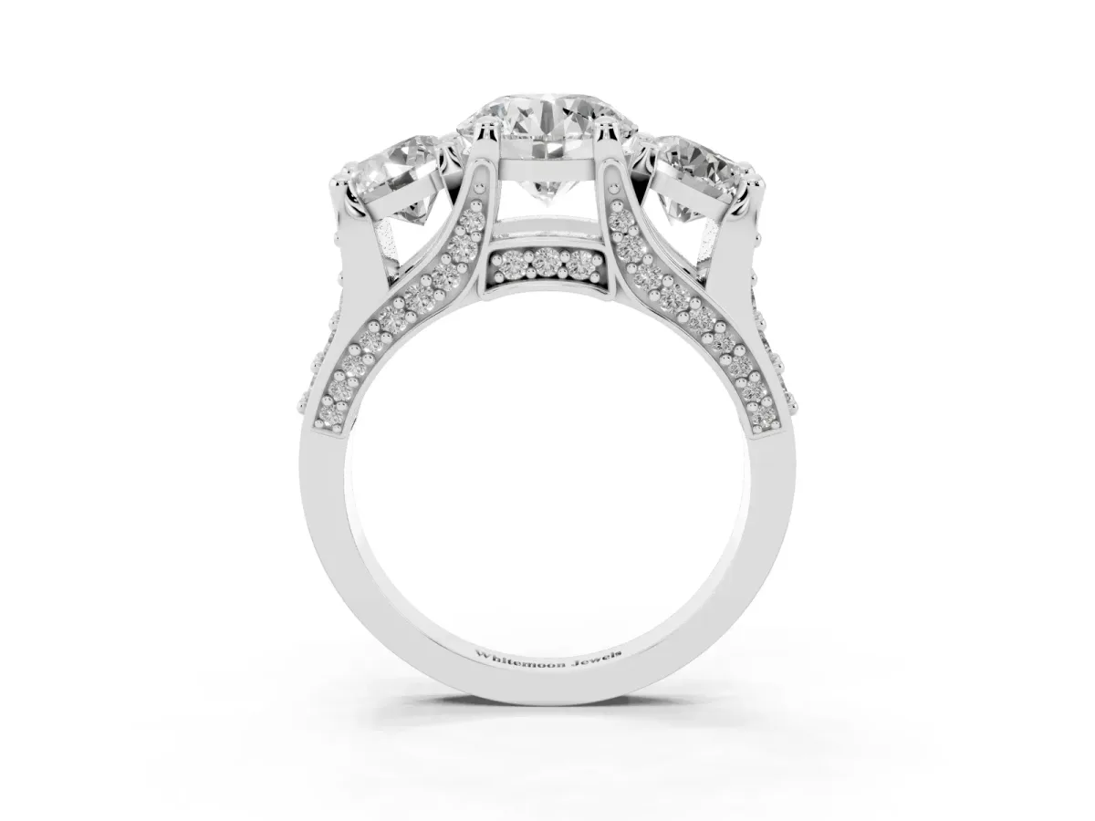 Round Cut Diamond Three-Stone Ring with Channel Set Band and Four-Prong Setting Silver