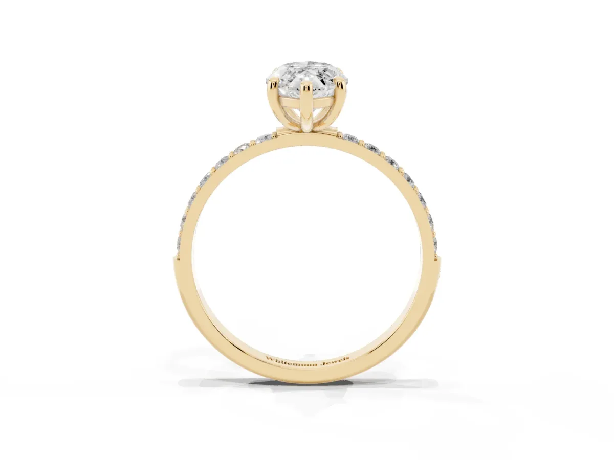 Marquise Cut Diamond Solitaire Ring with Round Pavé Band and Prong Setting Yellow gold