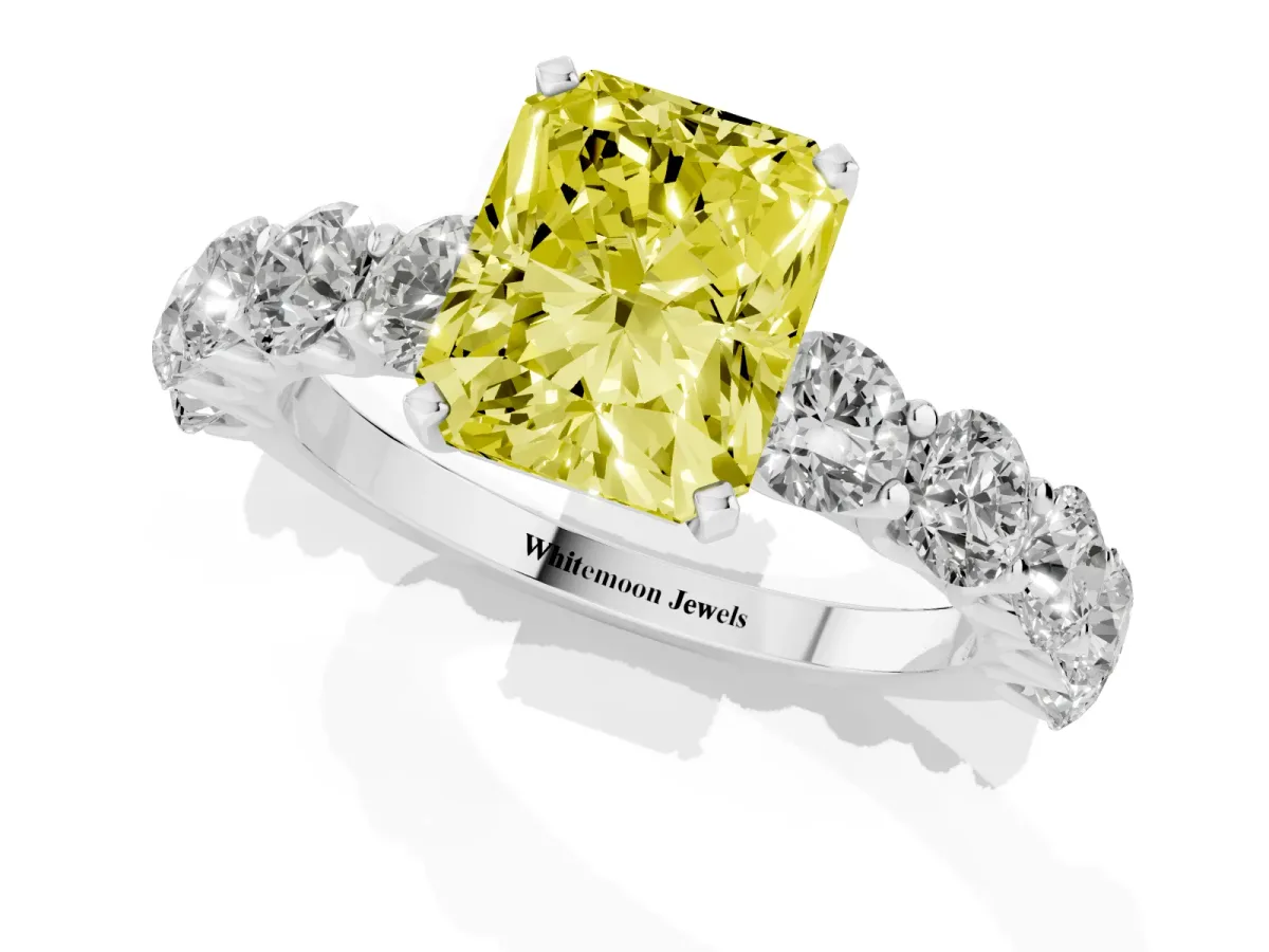 Fancy Yellow Radiant Cut Diamond Prong Setting with Side Stones on a Pave Band Silver