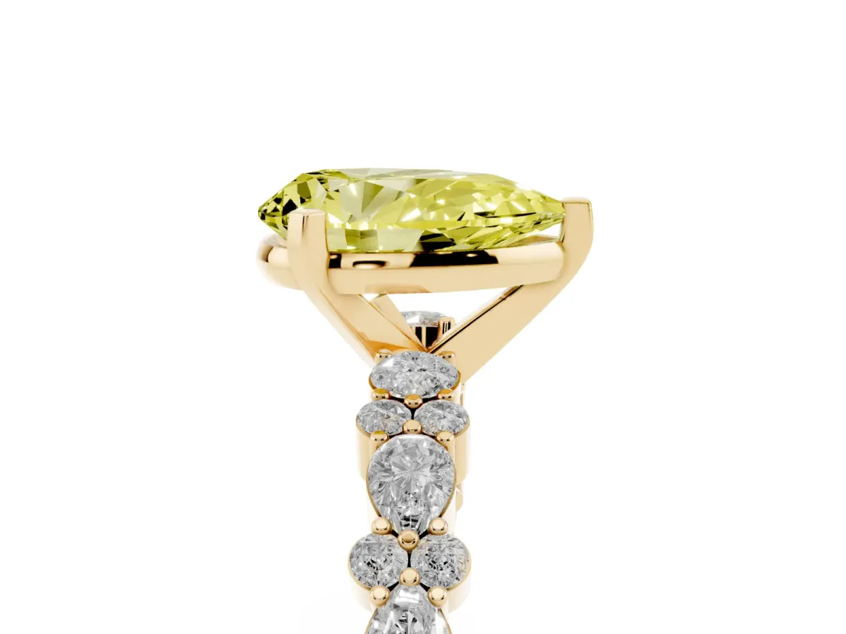 Fancy Yellow Pear Cut Diamond Side Stone Solitaire Ring with Round and Four-Prong Setting Yellow gold