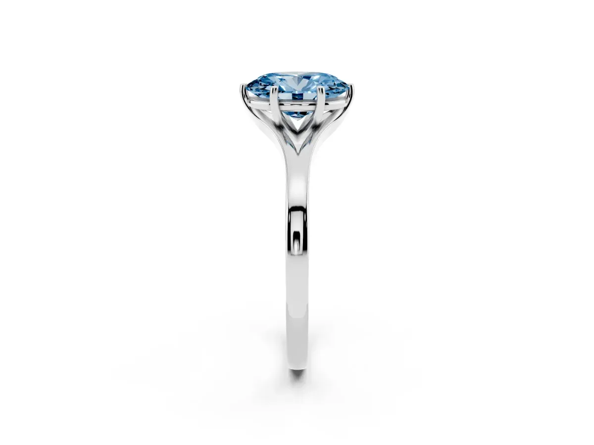 Fancy Blue Oval Cut Solitaire Diamond Ring with Six-Prong Setting and Tapered Band Silver