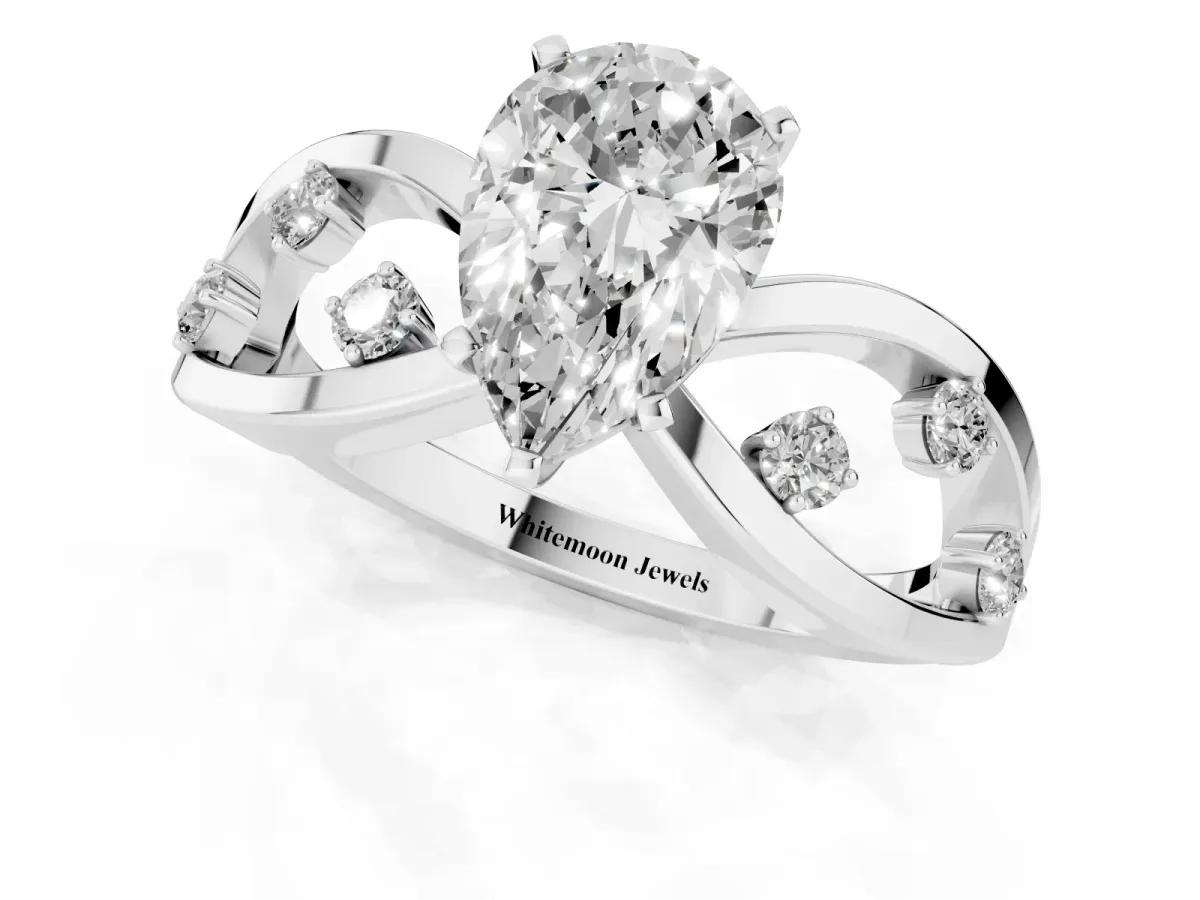 Pear Cut Cut Solitaire Diamond with Side Stones on Criss-Cross Band and Four-Prong Setting Silver