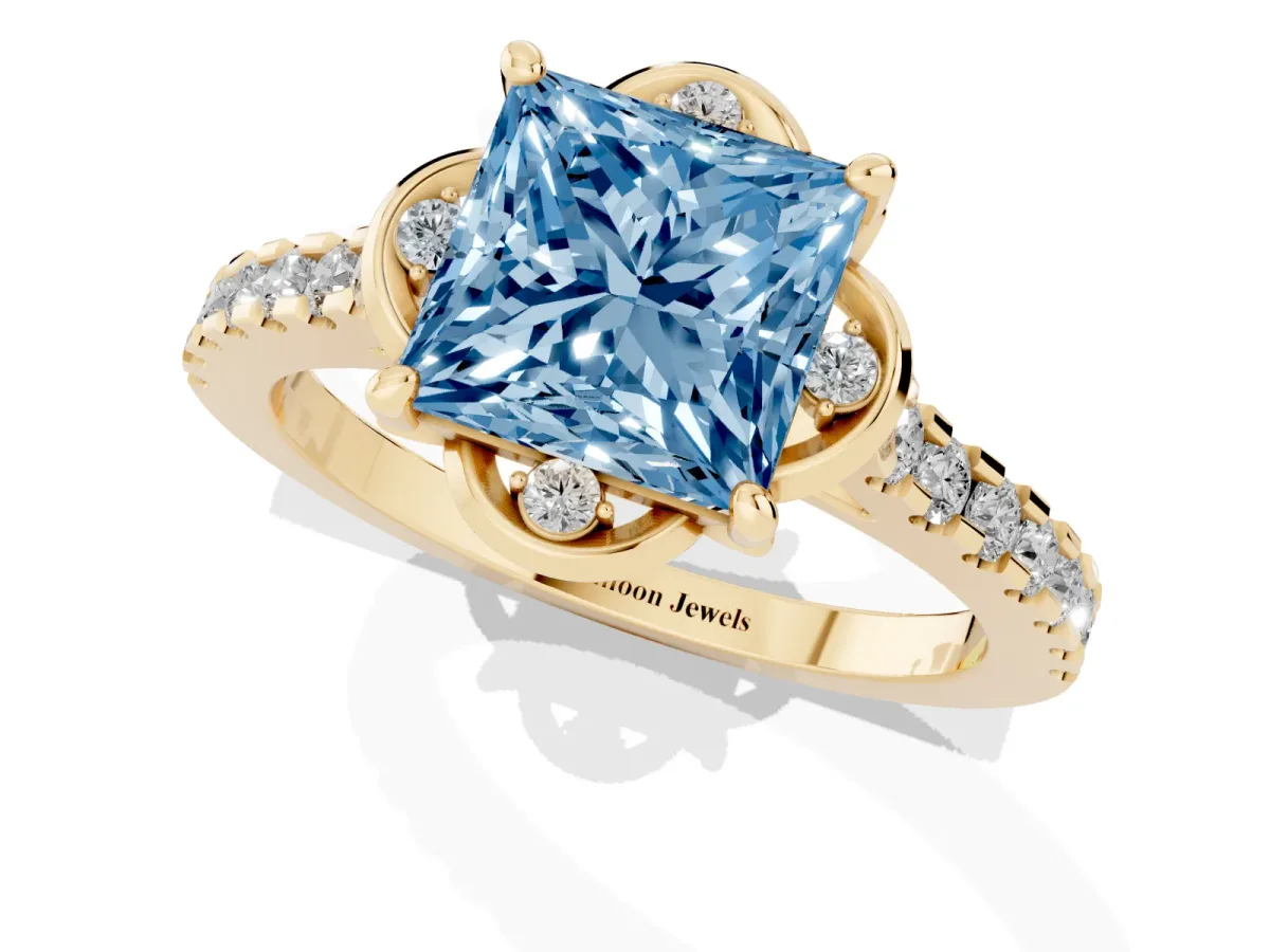 Fancy Blue Princess Cut Diamond Ring with Pavé Band and Floral Prong Setting Yellow gold