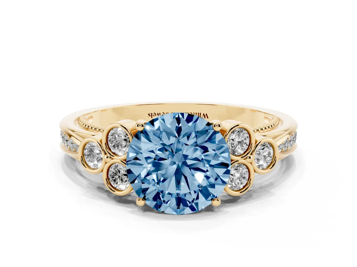 Fancy Blue Round Cut Cut Diamond Engagement Ring with Bezel Set Round Side Stones and Prong Setting Yellow gold
