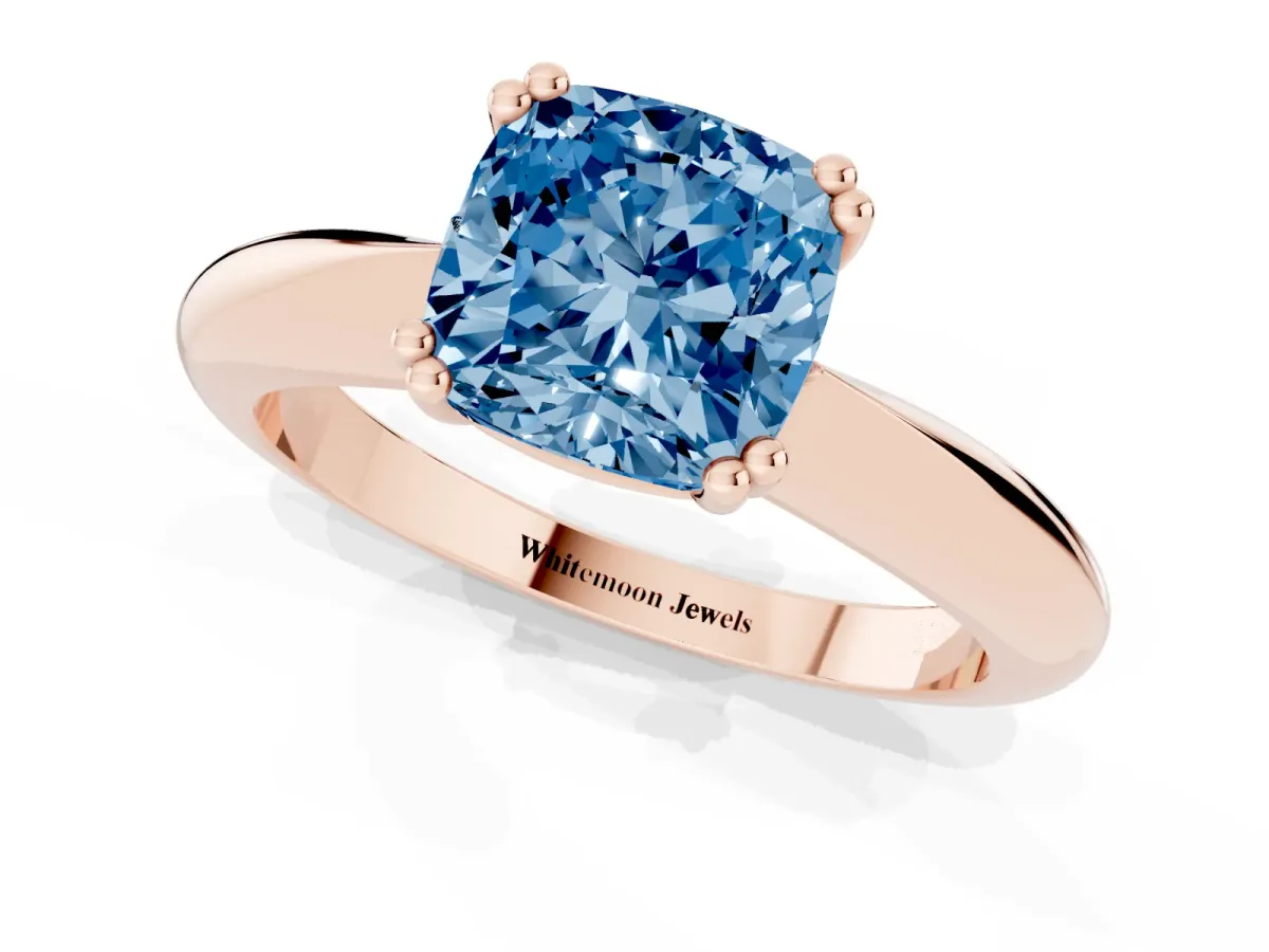 Fancy Blue Cushion Cut Cut Solitaire Engagement Ring with Tapered Band and Four-Prong Setting Rose gold