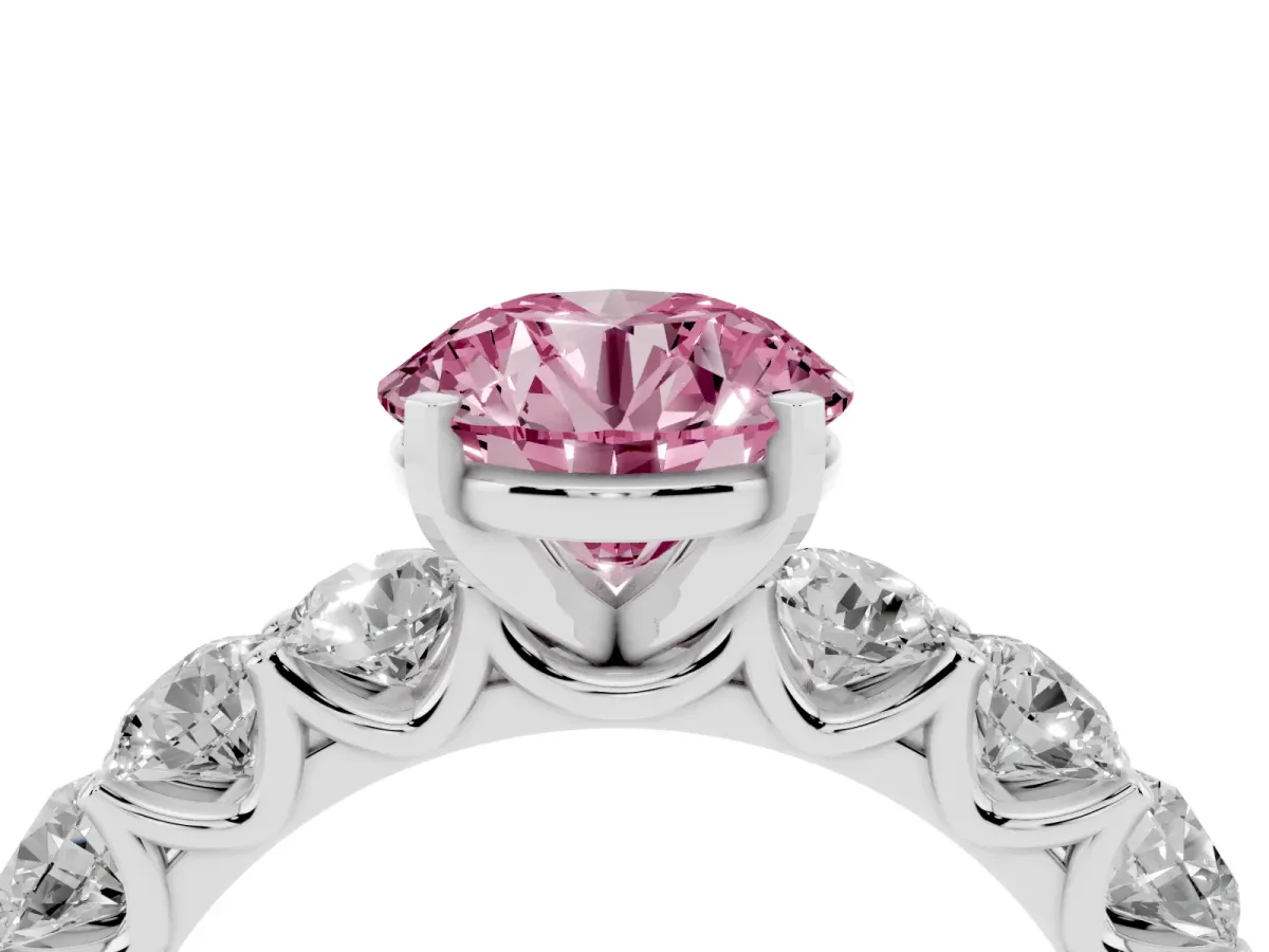 Fancy Pink Round Cut Diamond Prong Setting with Side Stones on a Pave Band Silver