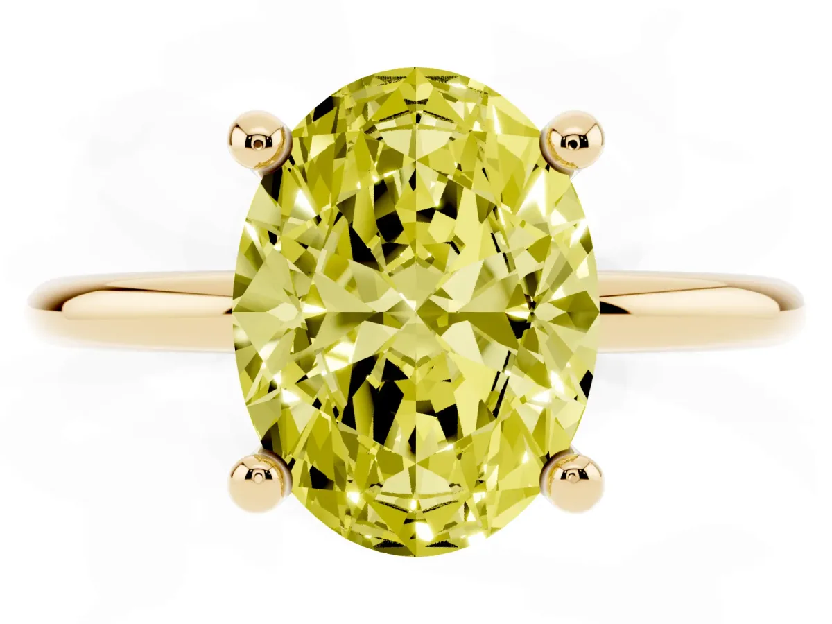 Fancy Yellow Oval Cut Solitaire Diamond Ring with 4-Prong Setting on a Classic Band Yellow gold
