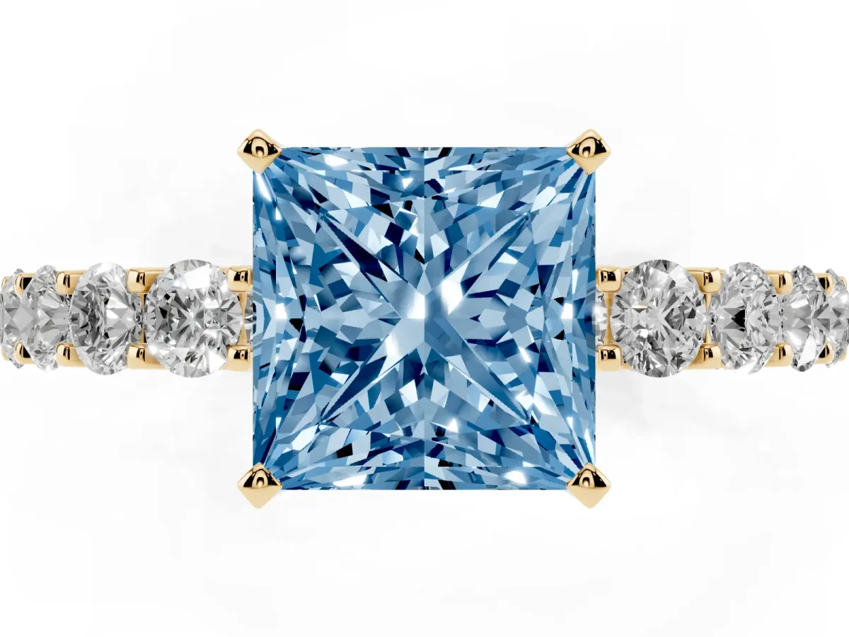 Fancy Blue Princess Cut Diamond Solitaire Ring with Shared Prong Pavé Band and Four-Prong Setting Yellow gold