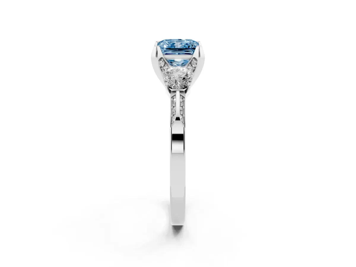 Fancy Blue Princess Cut Brilliant Three-Stone Diamond Ring with Pavé Band and Four-Prong Setting Silver