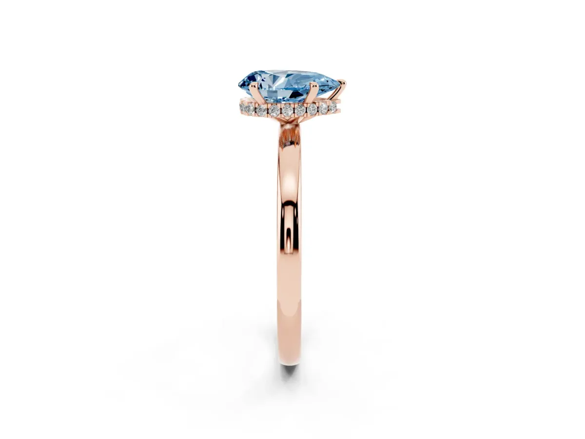 Fancy Blue Pear Cut Solitaire Engagement Ring with Cathedral Band and Four-Prong Setting Rose gold
