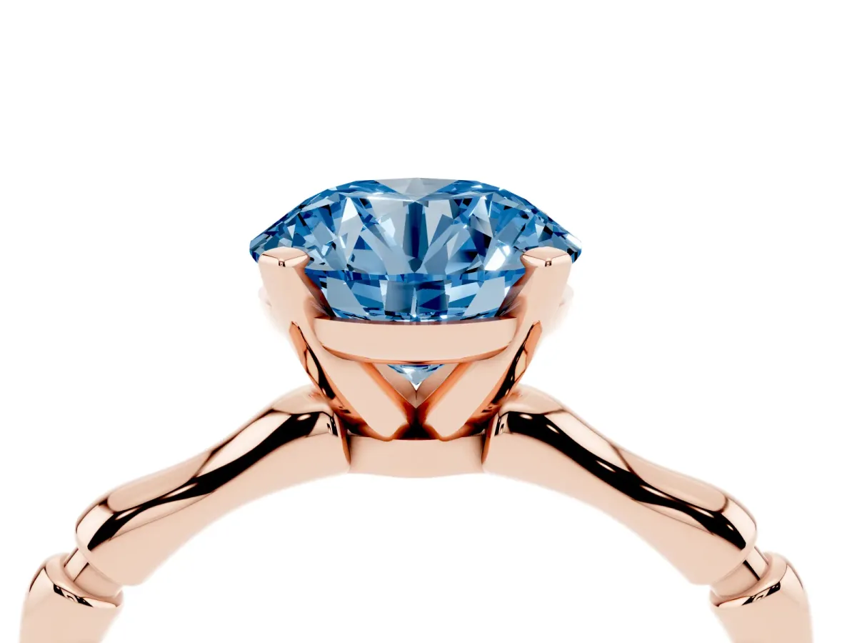 Fancy Blue Round Cut Solitaire Diamond Ring with Bamboo Band and Four-Prong Setting Rose gold