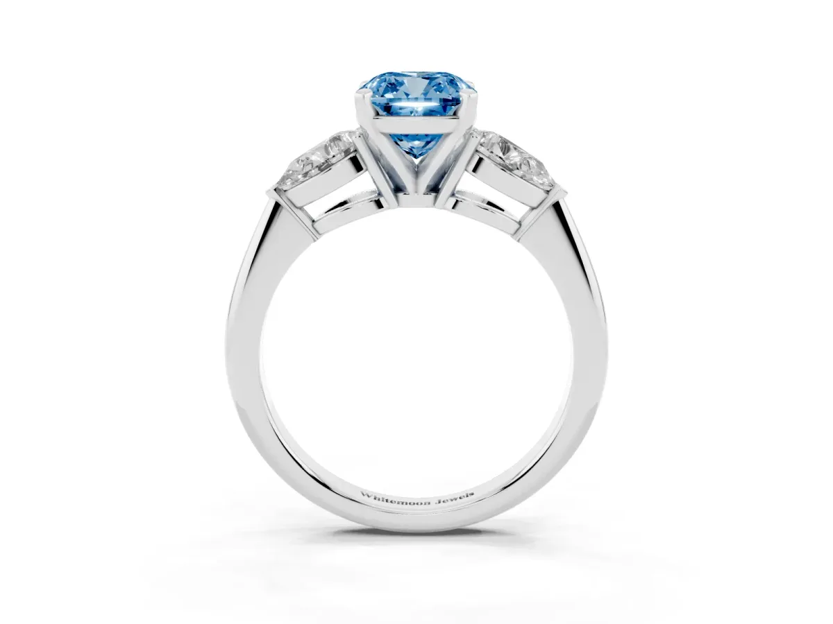 Fancy Blue Three-Stone Cushion Cut Diamond Ring with Pear Side Stones and Four-Prong Setting Platinum