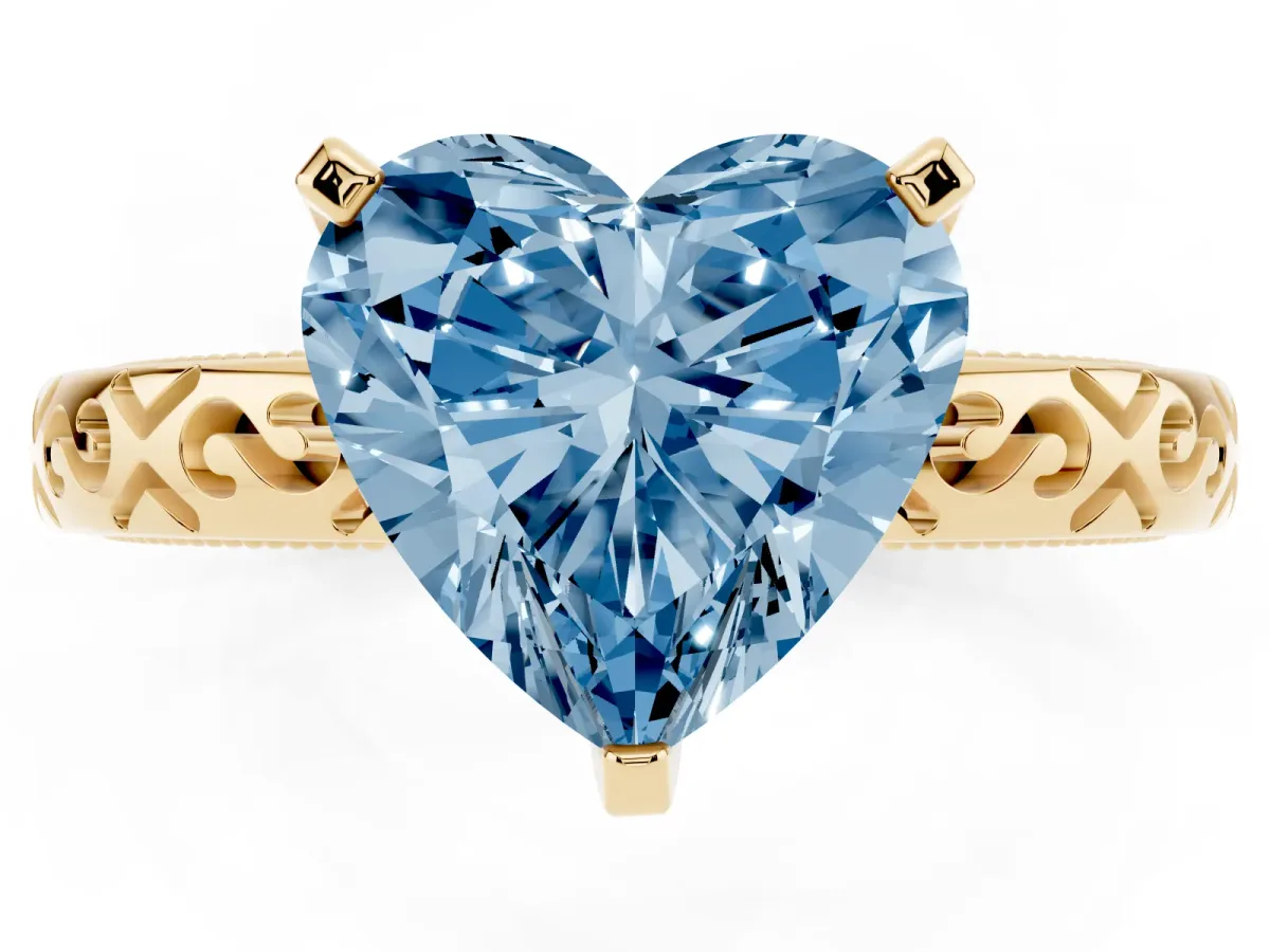 Fancy Blue Heart Cut Solitaire Engagement Ring with Scrollwork Band and Four-Prong Setting Yellow gold