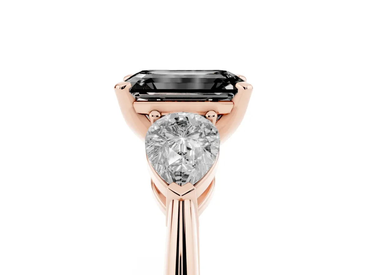Fancy Black Three-Stone Emerald Cut Diamond Ring with Pear Side Stones and Four-Prong Setting Rose gold