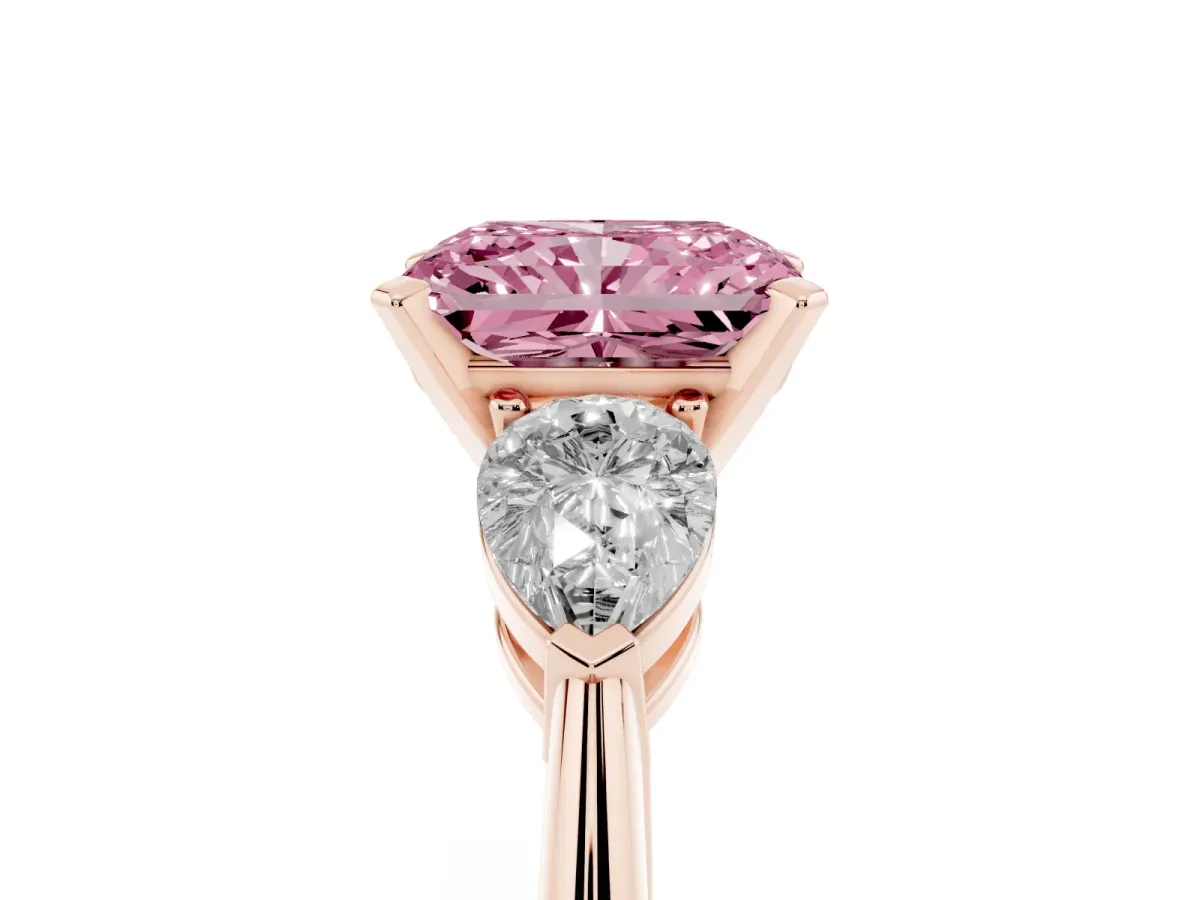 Fancy Pink Three-Stone Radiant Cut Diamond Ring with Pear Side Stones and Four-Prong Setting Rose gold