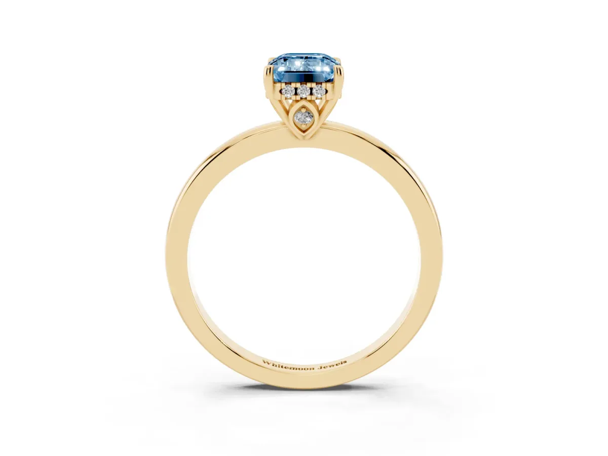 Fancy Blue Emerald Cut Solitaire Diamond Ring with Prong Setting and Plain Band Yellow gold