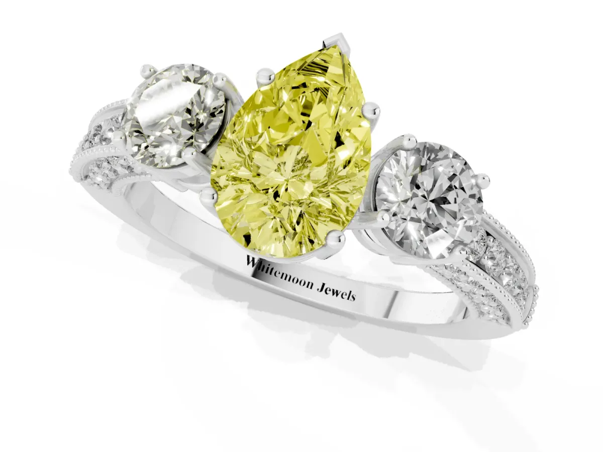 Fancy Yellow Pear Cut Three-Stone Diamond Ring with Pavé Band and Four-Prong Setting Silver