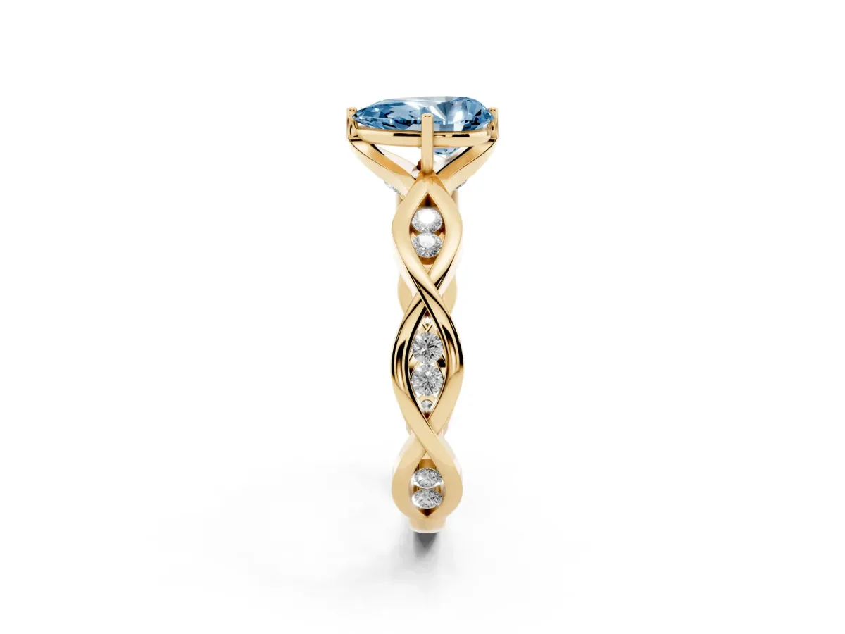 Fancy Blue Pear Cut Solitaire Twist Band with Leaf Prong Setting Yellow gold