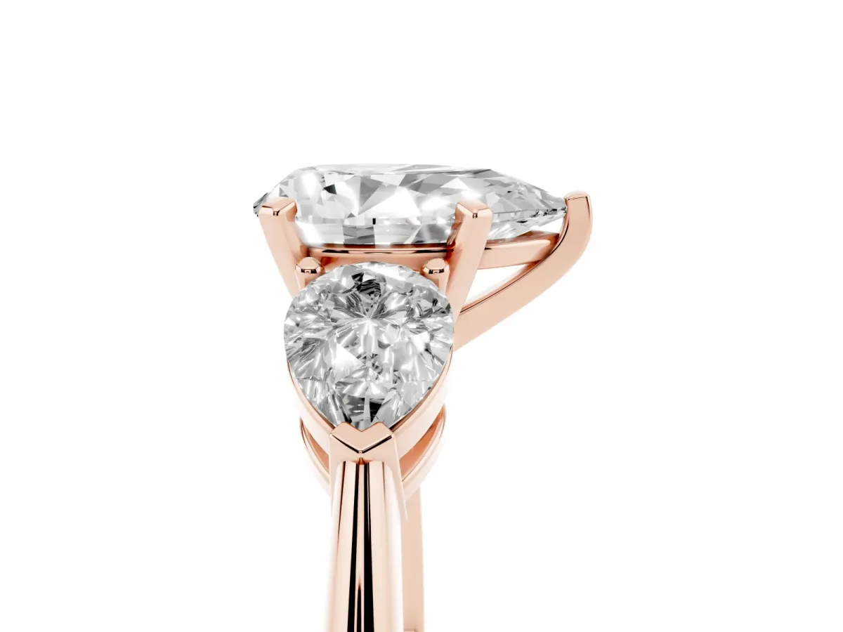Three-Stone Pear Cut Diamond Ring with Pear Side Stones and Four-Prong Setting Rose gold