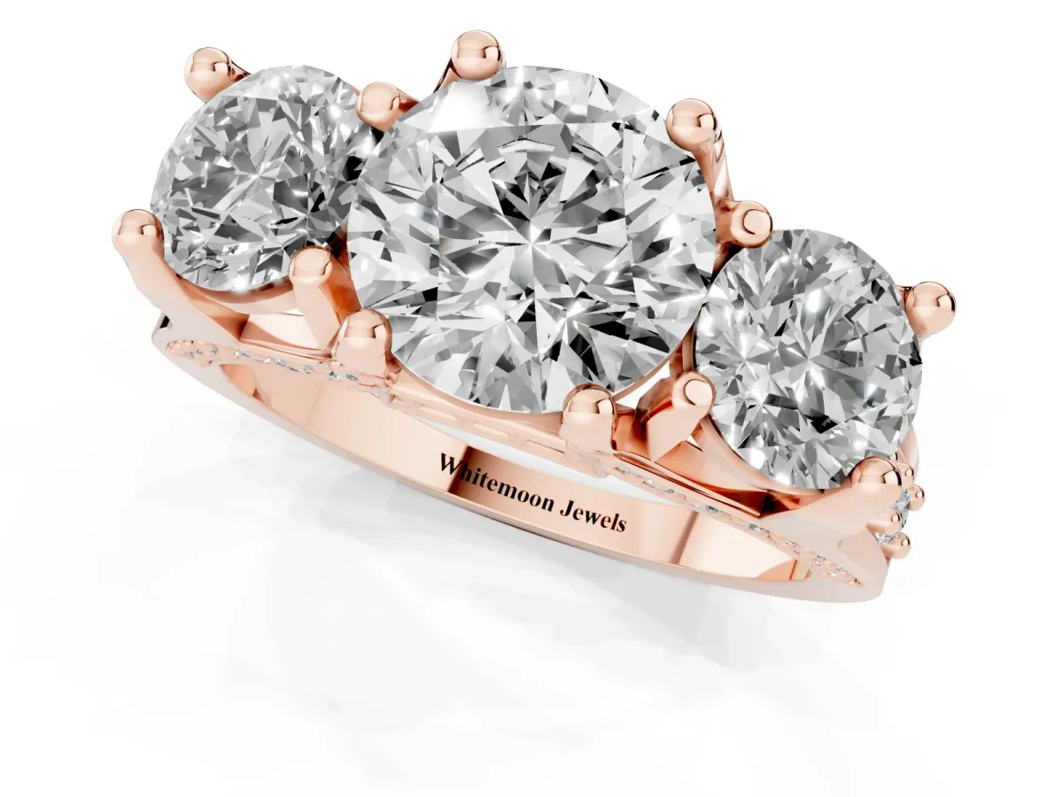 Round Cut Diamond Three-Stone Ring with Channel Set Band and Four-Prong Setting Rose gold