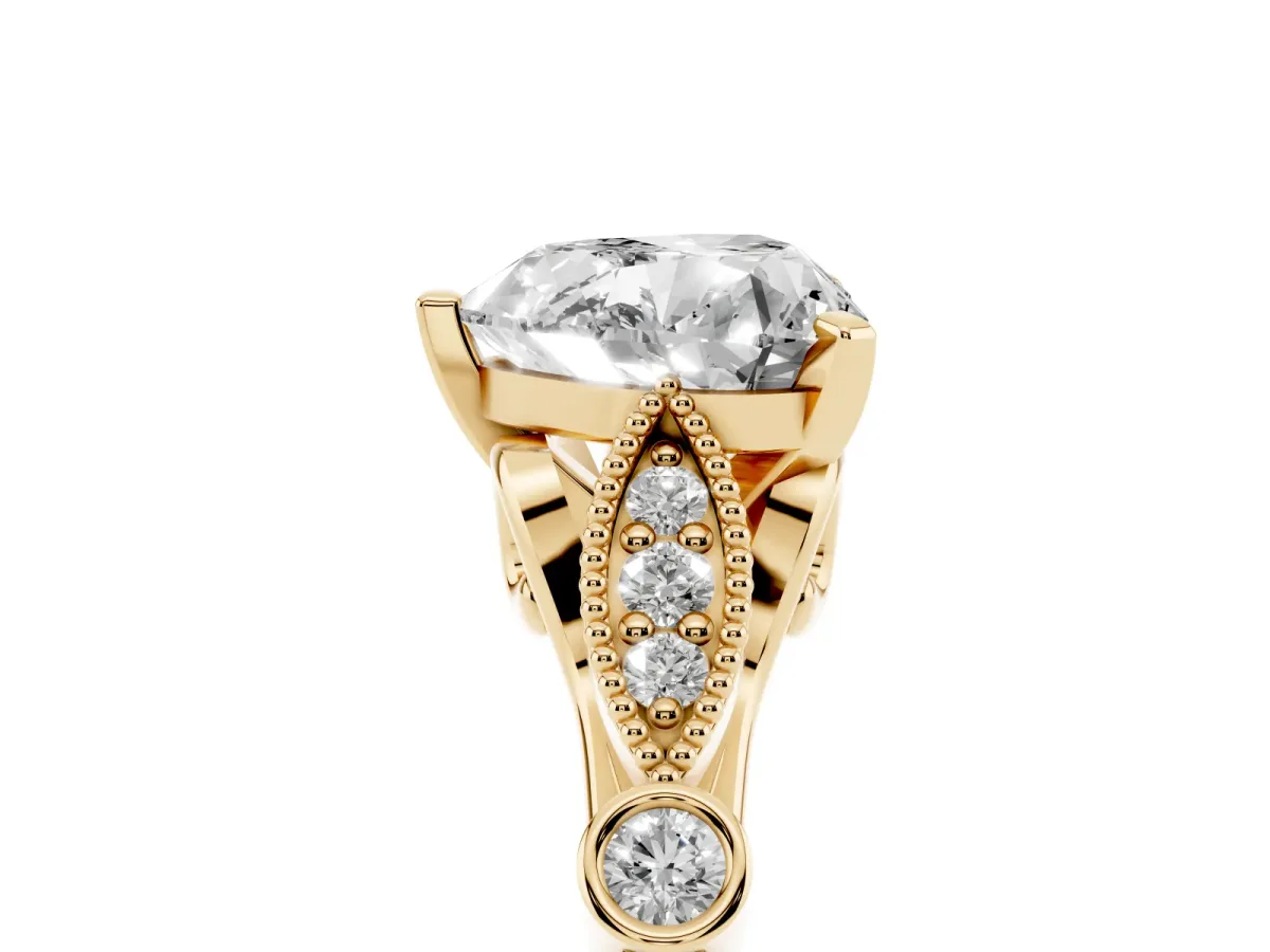 Heart Cut Cut Diamond with Milgrain Marquise and Bezel Accents on a Solitaire Band with Prong Setting Yellow gold
