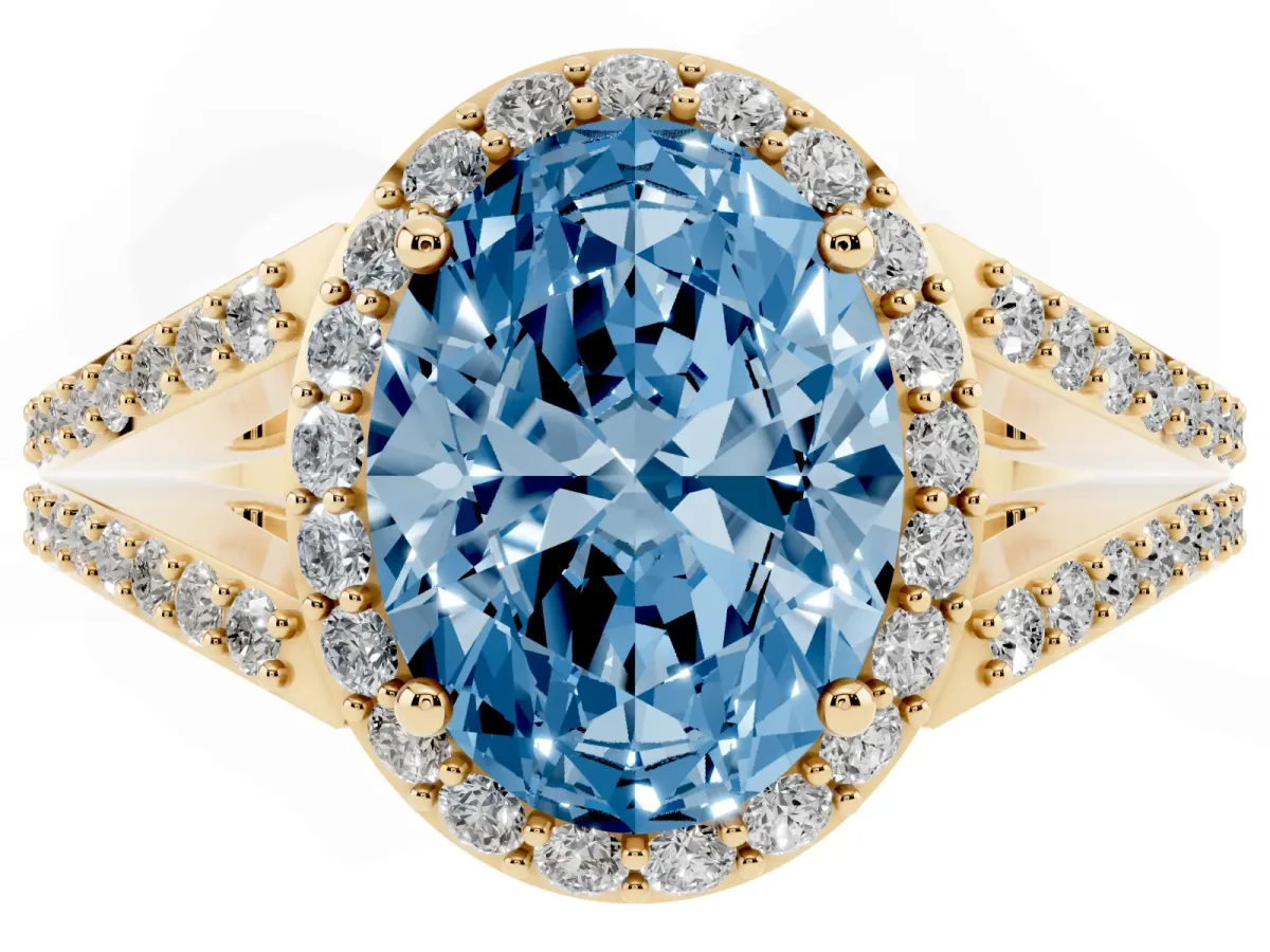 Fancy Blue Oval Cut Halo Split Shank Diamond Ring with Prong Setting Yellow gold