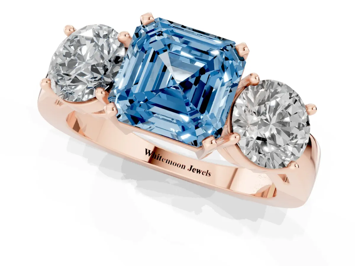 Fancy Blue Three-Stone Asscher Cut Diamond Ring with Round Side Stones, Classic Band, and Four-Prong Setting Rose gold