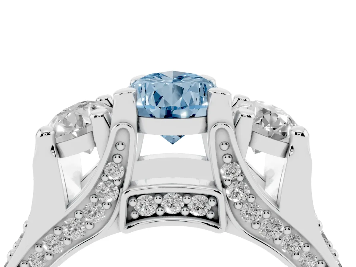 Fancy Blue Pear Cut Diamond Three-Stone Ring with Channel Set Band and Four-Prong Setting Silver