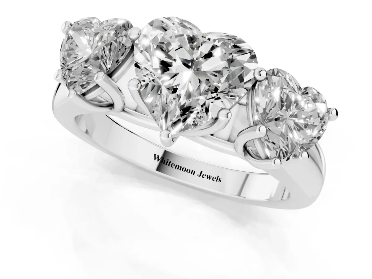 Heart Cut Three-Stone Diamond Ring with Prong Setting on a Classic Band White gold