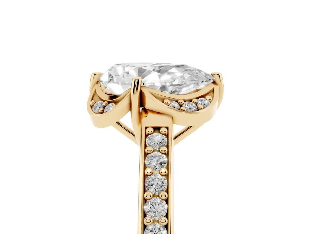Pear Cut Cut Halo Diamond Ring with Channel Set Band and Four-Prong Setting Yellow gold