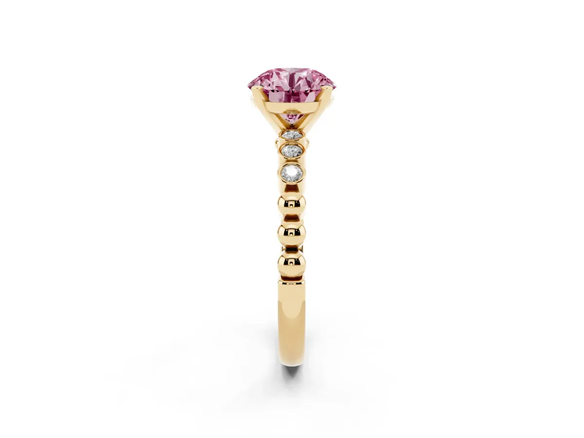 Fancy Pink Round Cut Solitaire Bezel Accent Diamond Engagement Ring with Beaded Band and Four-Prong Setting Yellow gold